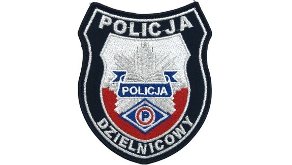 emblemat z napisem policja Dzielnicowy