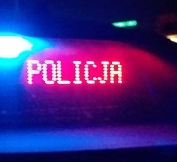 napis Policja i sygnały świetlne